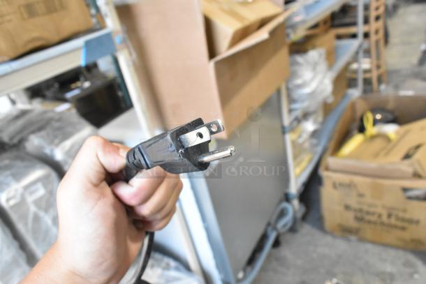 Power cord for Excellence EMM-3HC Metal Black Countertop Display Refrigerator, 115 Volts, 1 Phase, visible in warehouse.
