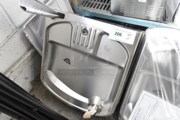Brand new Elkay wall mount water fountain, scratch and dent condition, included paperwork, labeled for auction lot 206.