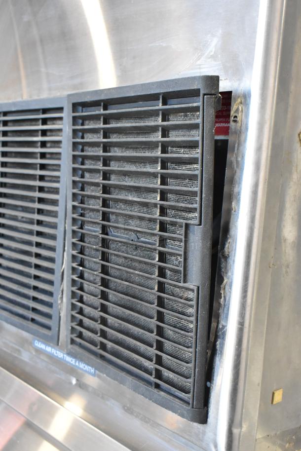 Hoshizaki F-1001MAH commercial ice maker, 208-230V, 1 phase, metal exterior, view of air filter on ice bin, used condition.