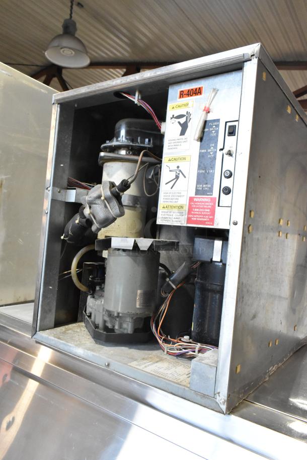 Hoshizaki F-1001MAH metal commercial ice head on bin, 208-230V, 1 phase, used condition, interior view showing components.