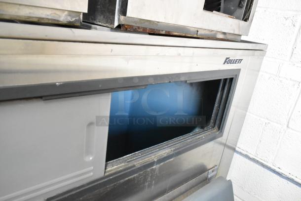 2 Hoshizaki F-1000MRB ice heads on Follett LSG1 ice bin, metal, 208-230V, 1 phase. Visible Follett logo.
