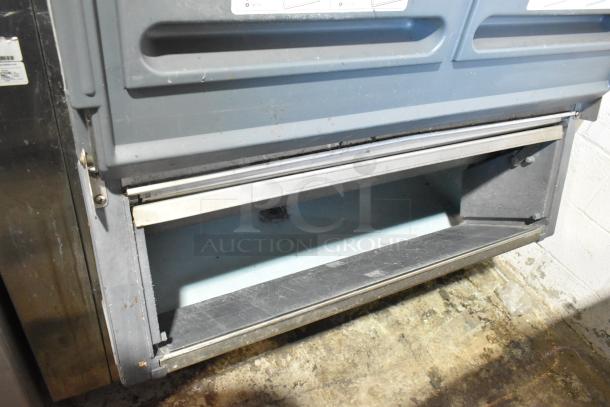 2 Hoshizaki F-1000MRB Metal Ice Heads on Follett LSG1 Bin, 208-230V, 1 Phase, industrial setting, visible wear.