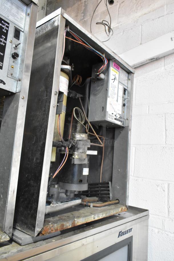 2 Hoshizaki F-1000MRB ice heads on Follett LSG1 bin, metal exterior, shows wear. 208-230V, 1 phase, commercial use.