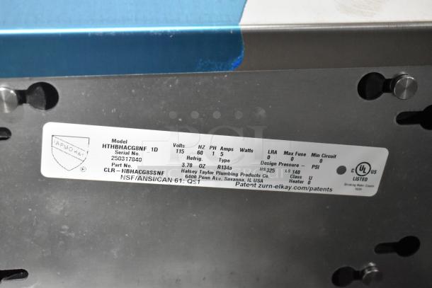 Brand new Halsey Taylor HTHBHACG8NF_1D wall mount water fountain with bottle filler. Scratch and dent condition. Model tag shown.