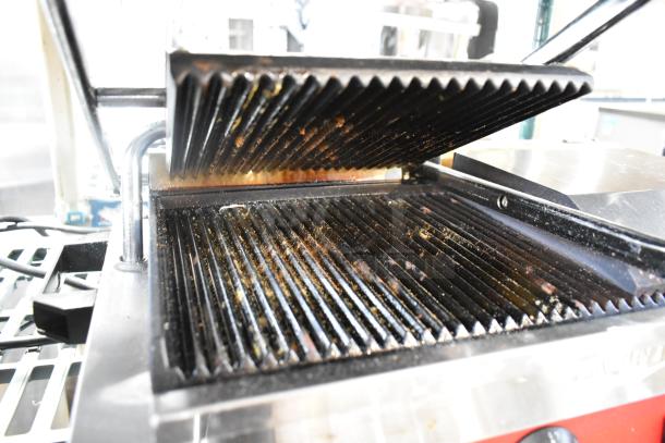 Avantco 177PG400 dual Panini grill, grooved plates, 19 5/8"x9 1/8" cooking surface, brand new, scratch and dent, stainless steel.
