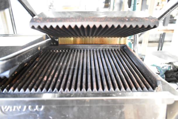 Brand new 2023 Avantco 177PG400 dual panini grill with grooved plates, 19 5/8" x 9 1/8" cooking surface. Scratch and dent.