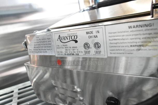 Brand new Avantco 177PG400 Panini Grill, stainless steel, dual grooved plates, 19 5/8" x 9 1/8" surface, 120V.