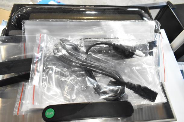 Brand new VacPak-It Ultima UVME12SS vacuum packing machine, 12" seal bar, roll cutter, dual piston dry pump, 120V, 460W.