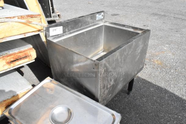 Krowne 18-24 stainless steel ice bin with two missing legs, slight wear visible, label includes item ID 210.