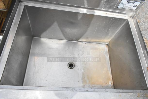Krowne 18-24 stainless steel ice bin, interior view. Includes drainage hole, missing 2 legs. Visible Krowne label.
