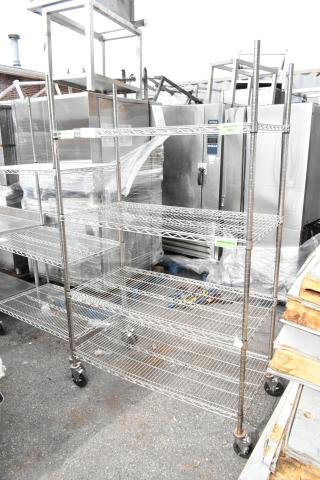 Chrome finish 4-tier wire shelving unit on commercial casters. Sturdy design, ideal for storage. Dismantling required.