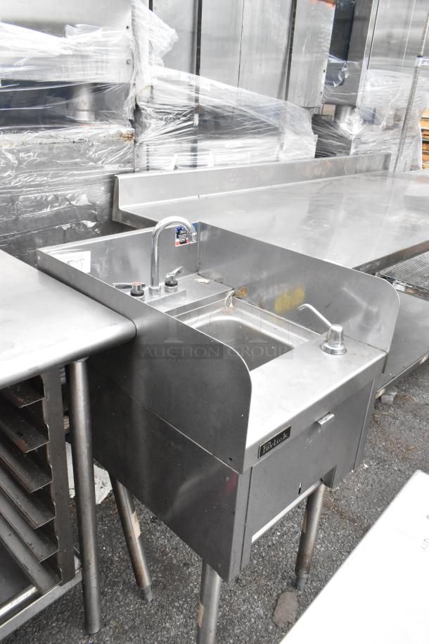 Perlick stainless steel single bay sink, featuring a faucet, clean surface, and Perlick label. Appears in good condition.
