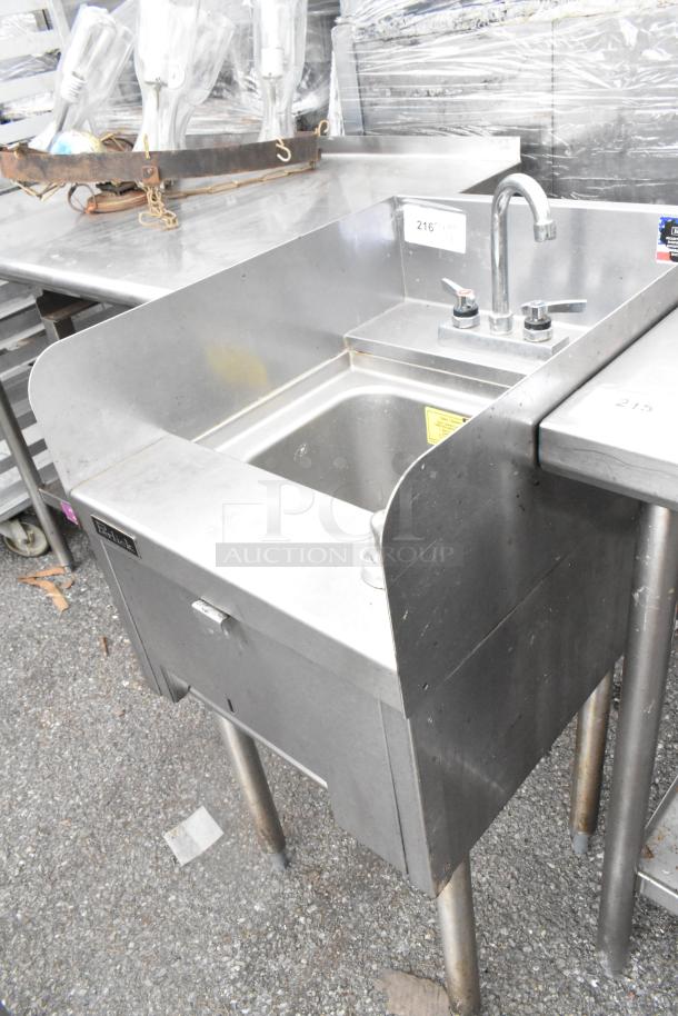 Perlick stainless steel single bay sink with splash guard, commercial faucet, and durable legs, in good condition.