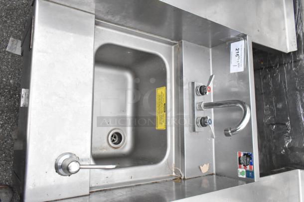 Perlick stainless steel single bay sink with dual faucet controls, in used condition. Visible manufacturer labels and model details.
