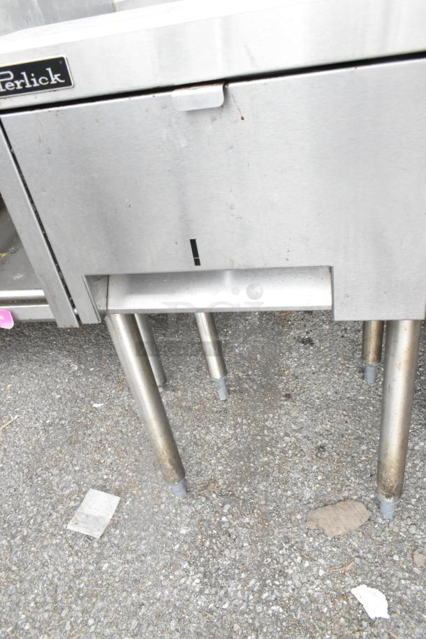 Perlick stainless steel single bay sink with visible brand label, sturdy legs, and minor wear. Ideal for commercial use.