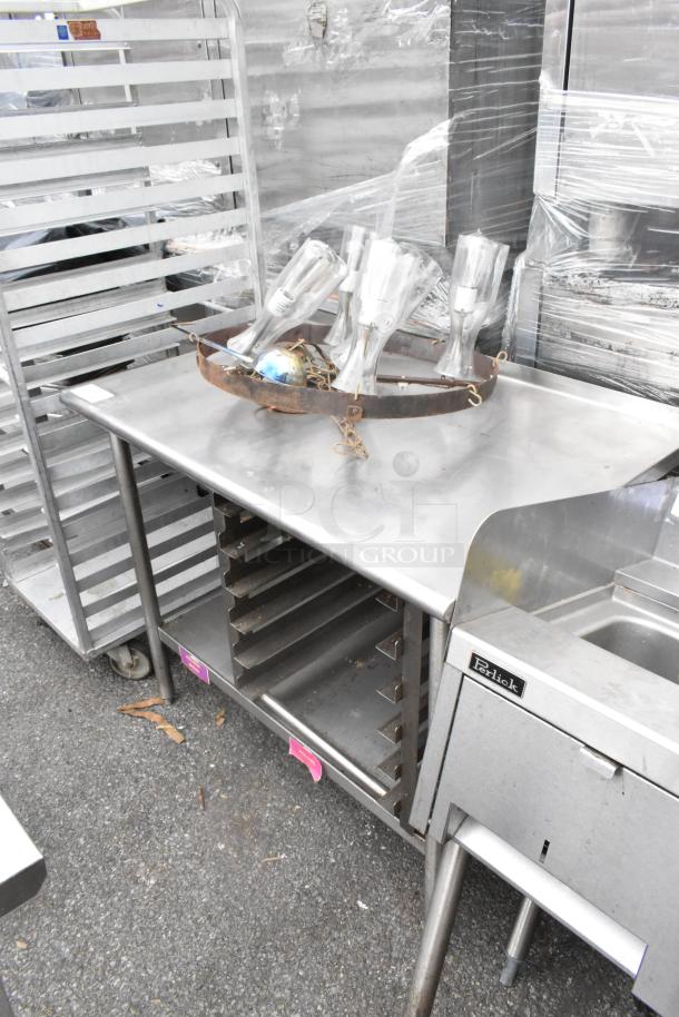 Stainless steel table with under shelf, pan rack, Perlick brand. Includes glass items on top. Good condition.
