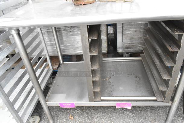 Stainless steel table with under shelf, pan rack, visible tags labeled "Pita Bags Brown" and "Pita Chips," some wear.