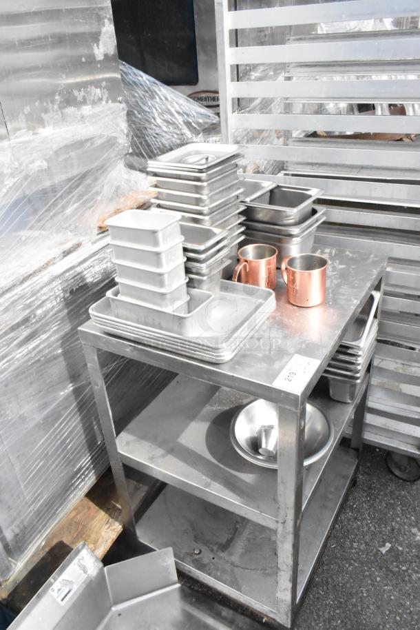 Metal 3-tier cart on commercial casters with stainless steel drop-in bins and copper mugs on top shelf. Used condition.