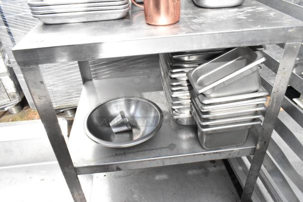 Metal 3-tier cart on commercial casters with stainless steel drop-in bins, includes multiple bins and funnel. Good condition.