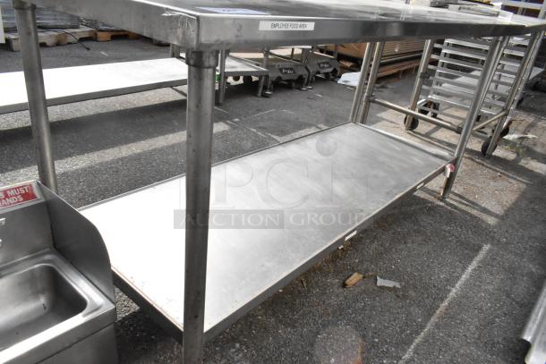 Stainless steel table with under shelf and 2-tier over shelf, in good condition. Marked "Employee Food Area".