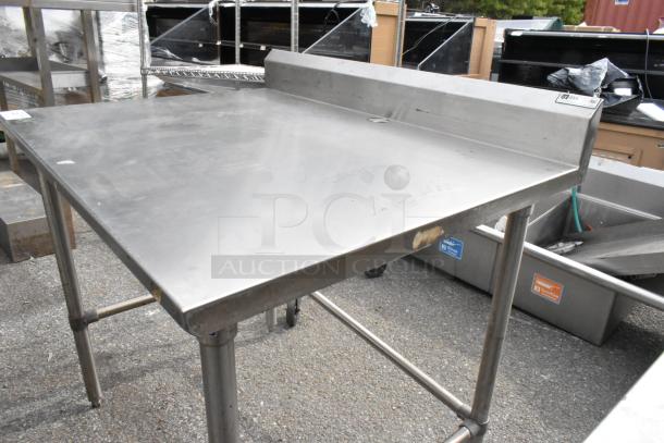 John Boos stainless steel table, used condition, features a backsplash and sturdy legs, ideal for commercial kitchens.