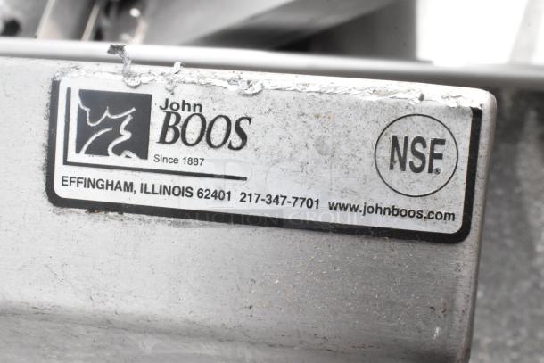 John Boos stainless steel table with NSF certification label, featuring Effingham, Illinois contact details. Slight wear visible.