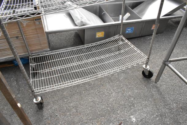 Chrome finish 3-tier wire shelving unit with commercial casters, in good condition. Buyer must dismantle for shipping.