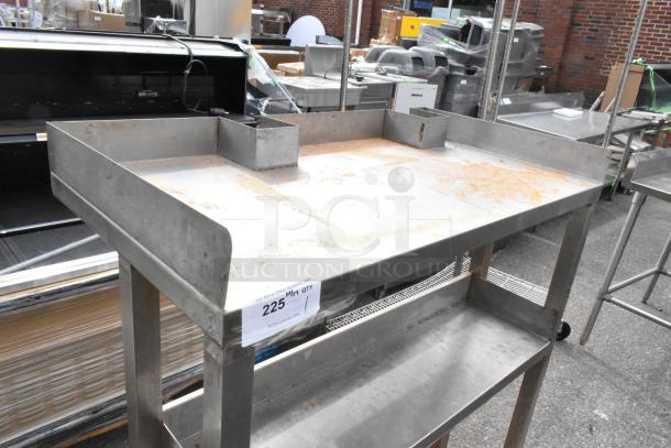 Metal table with raised edges and under shelf, showing rust and wear. Label indicates auction lot number 225.