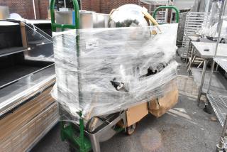 Uline green metal U-boat on casters, wrapped with contents including sous vide and metal chafer frame. Auction tag 226 visible.