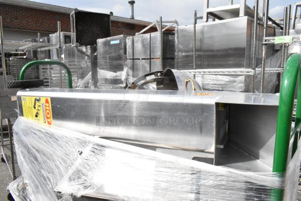 Uline green metal U-boat on casters with sous vide, metal chafer frame. Includes "HOT" label. Wrapped in plastic.