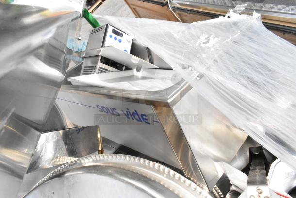 Uline green metal U-boat with casters, includes sous vide and metal chafer frame. Appears wrapped in protective plastic.