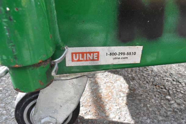 Uline green metal U boat on casters, label visible, includes sous vide and metal chafer frame, good condition.