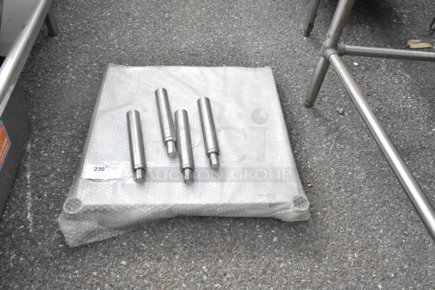 Winco Metal U Shelf with four chrome legs, wrapped in bubble wrap, on concrete. Auction label with item details attached.