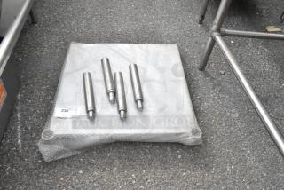 Winco Metal U Shelf with four chrome legs, wrapped in bubble wrap, on concrete. Auction label with item details attached.