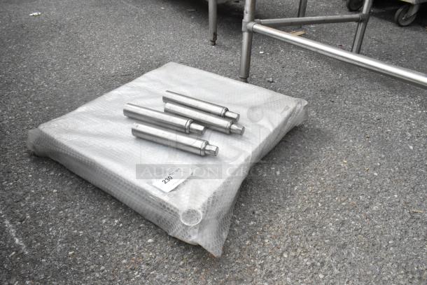 Winco Metal U Shelf, unused, wrapped in bubble wrap with four metal rods. Auction tag reads "230."