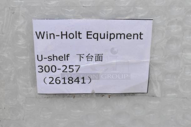 Win-Holt Equipment U-shelf model 300-257 label on protective plastic packaging, item code 261841, new condition.