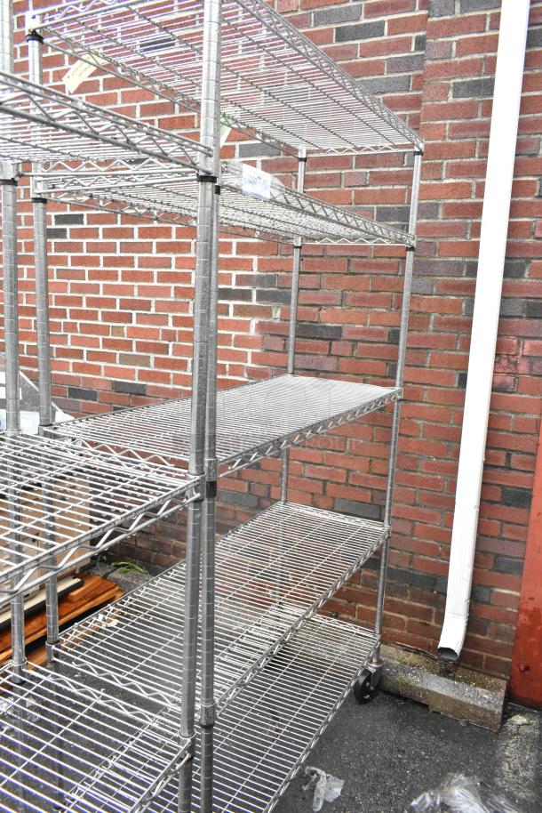 Chrome finish 5-tier wire shelving unit on commercial casters, suitable for heavy-duty storage. Buyer must dismantle.