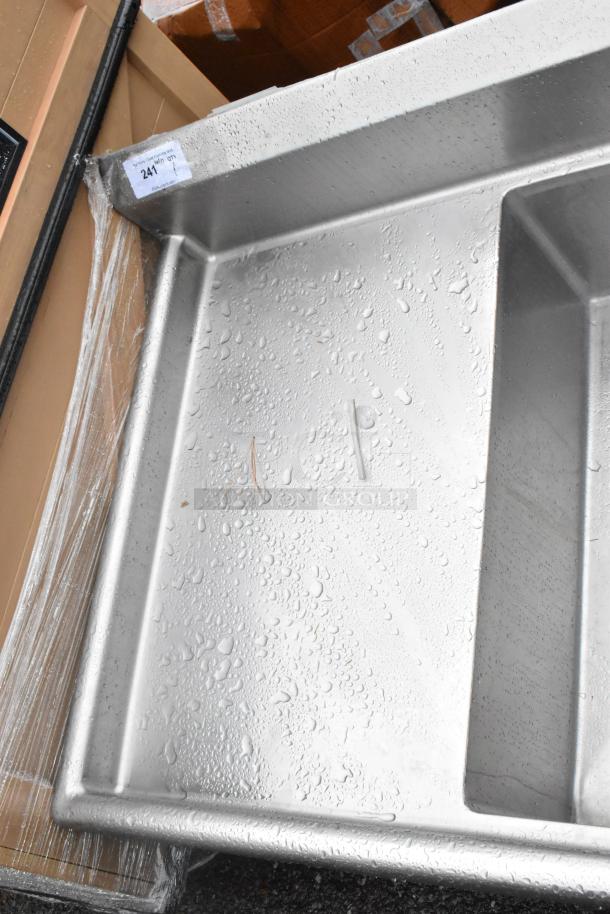 Stainless steel 3 bay sink with dual drain boards, no legs; auction tag labeled "247", unused condition.