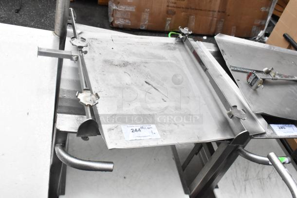 Face to Face stainless steel commercial meat slicer stand with adjustable arms, sturdy frame, moderate wear, item tag visible.