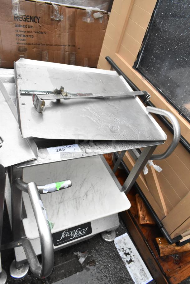 Face to Face stainless steel commercial meat slicer equipment stand in used condition, with visible wear and markings.