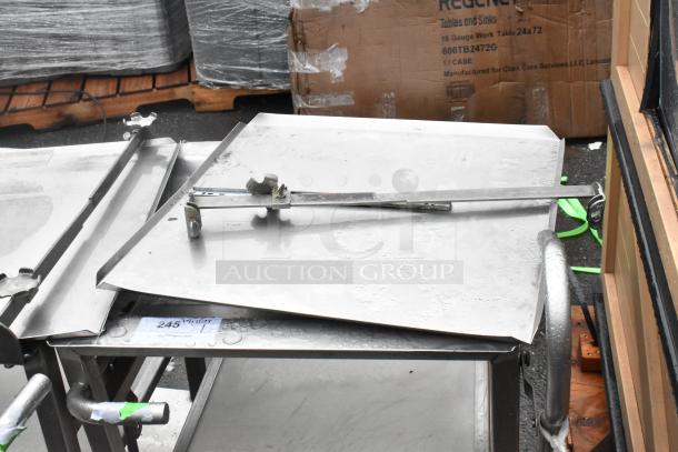 Face to Face stainless steel commercial meat slicer stand, robust condition, features adjustable support arm, ideal for heavy-duty use.