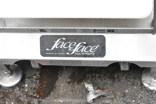 Face to Face stainless steel commercial meat slicer equipment stand, features brand logo and sturdy construction.