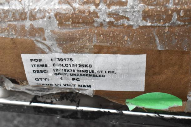 Label on Regency 600LC16125KG locker box showing dimensions 12"x15"x78", gray color, unassembled, minor scratches.