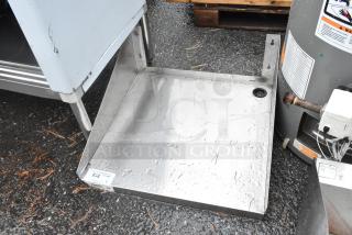 Regency 600MS2424 stainless steel wall mount shelf, used with minor wear, designed for durable storage solutions.