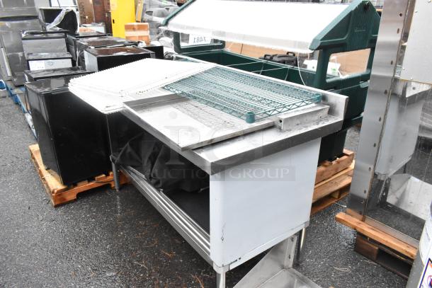 Steelton 522EBTBKD3060D 30"x60" stainless steel table with sliding doors, 4" backsplash, and included contents.