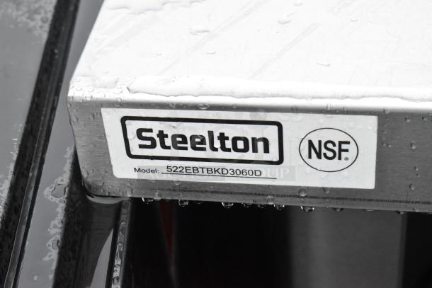 Steelton 522EBTBKD3060D stainless steel table; 30"x60", 16 gauge, type 430, enclosed base, sliding doors, 4" backsplash.