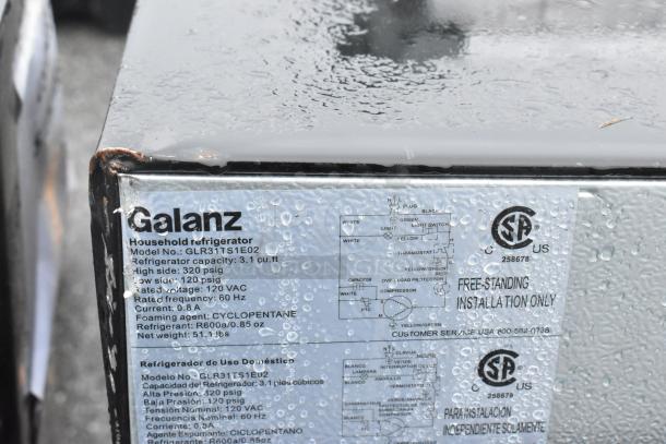 4 mini coolers including Galanz GLR31TS1E02. 3.1 cu. ft, 120V, 1 phase. Rust and water droplets on enclosure.