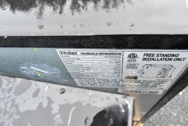 Label on Haier HC27SW20RB mini cooler, 2.7 cu ft, 115V, for free-standing installation. UL listed compliance.