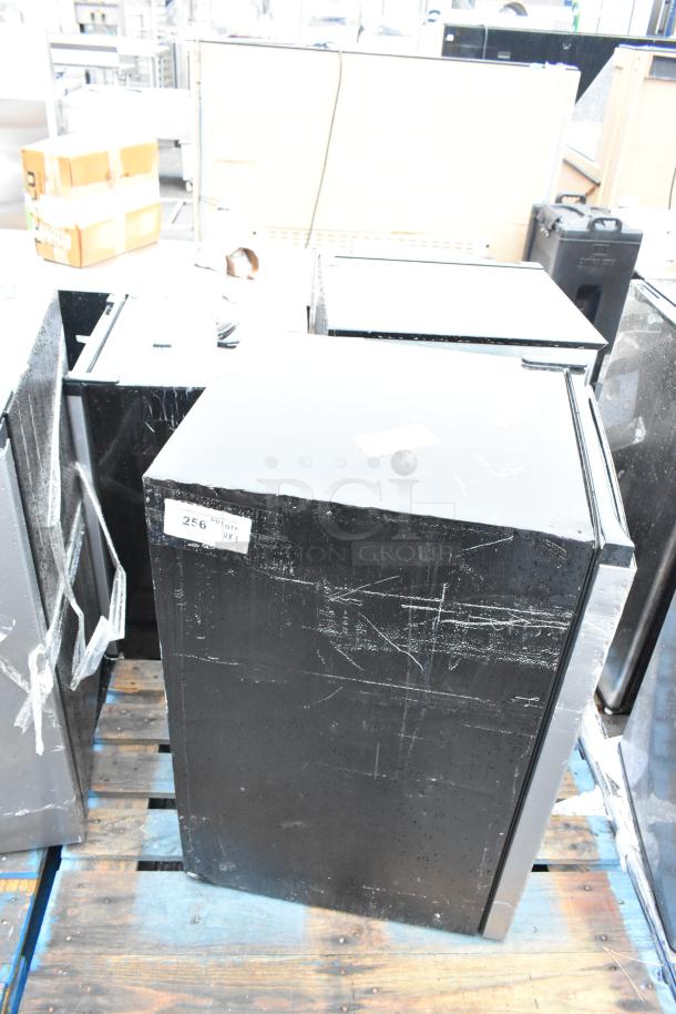 Three mini coolers on a pallet, including Haier HC27SW20RV. Clearly used, marked with "256 QTY WX3". 120 volts, 1 phase.