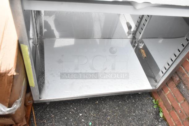 Regency 600EBTB2436 stainless steel table, 24x36, enclosed base, adjustable midshelf, scratch and dent, 16 gauge, new.